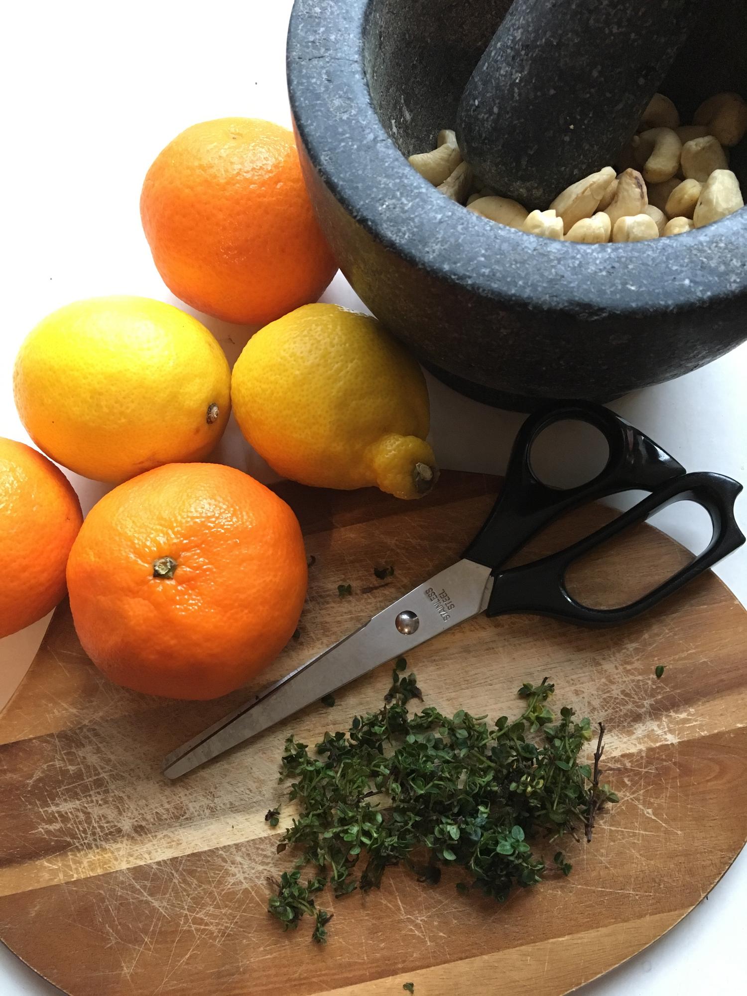 close-up of herbs and citrus being zested
